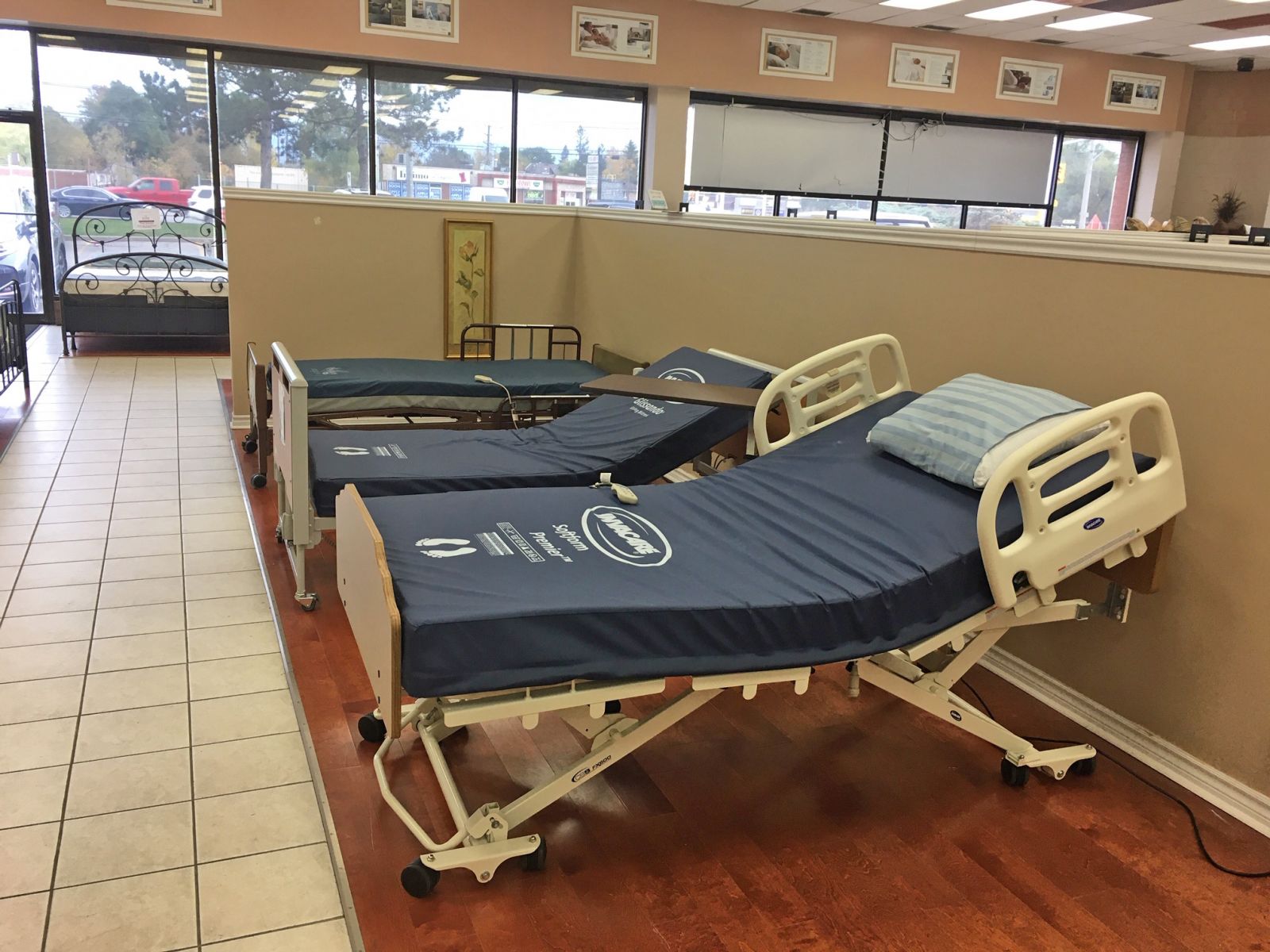 Three hospital beds on display in a Mississauga store
